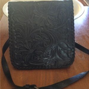 Navy blue Patricia Nash bag with scrolling on front flap. I do have dust cover.